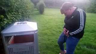 Pissing Into Bin in the Park