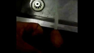 Peeing Into A Stainless Steel Urinal