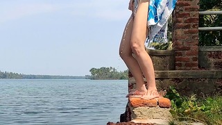 Shameless Guest Babe Pissing On the Public Waterfront Taking Her Swimsuit.