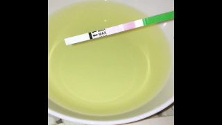 Girl Pissing On Plate Over The Toilet And Doing An Ovulation Test