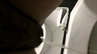 Piss From A Hairy Cunt In A Public Toilet