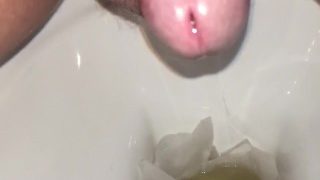 Pissing into toilet