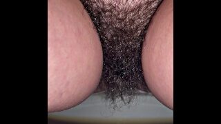 Couldn’t hold it anymore! Pretty hairy pussy pissing at the bar