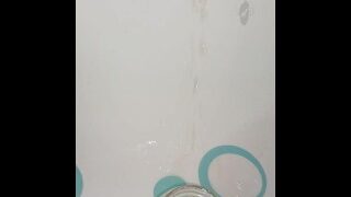 Creamy pussy pisses at a drinking glass