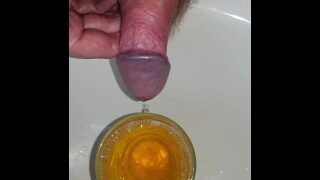 Desperate piss in a glass then pour it over my cock
