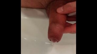 I pee in the sink with a dick that just leaked cum.
