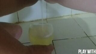 Juice From Urine. Milf Pissing In Glass.