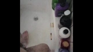 Peeing into the bathtub with water in it