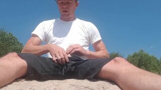 Risky pissing, jerking, and cumming on a public river bank