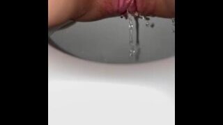 She decided to pee instead of sex. Pussy closeup view.