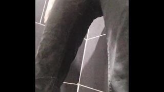 Slowly wetting black jeans