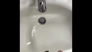 Taking a naughty piss in a public restroom sink hope I get caught
