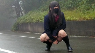 Transgender Honoka Peeing Openly In The Center Of The Road.