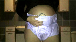 Pregnant peeing in her diaper