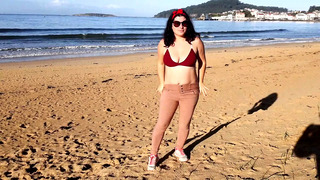 Woman Pissing on a Public Beach While No One Is There