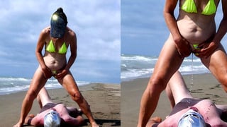 Femdom pissing on the beach