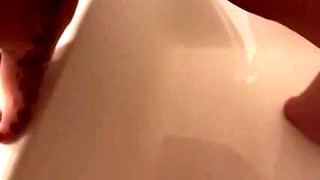 Wife pisses in the bath