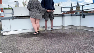 Gorgeous pissing mother-in-law helps son-in-law piss on the top of the parking lot